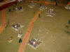 ... and the 1/27e de Ligne materializes in the edge of the woods outflanking the Prussians.