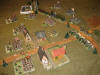 The Russians deploy a heavy battery to cover the exit of the village, whereas the baggage follows the road